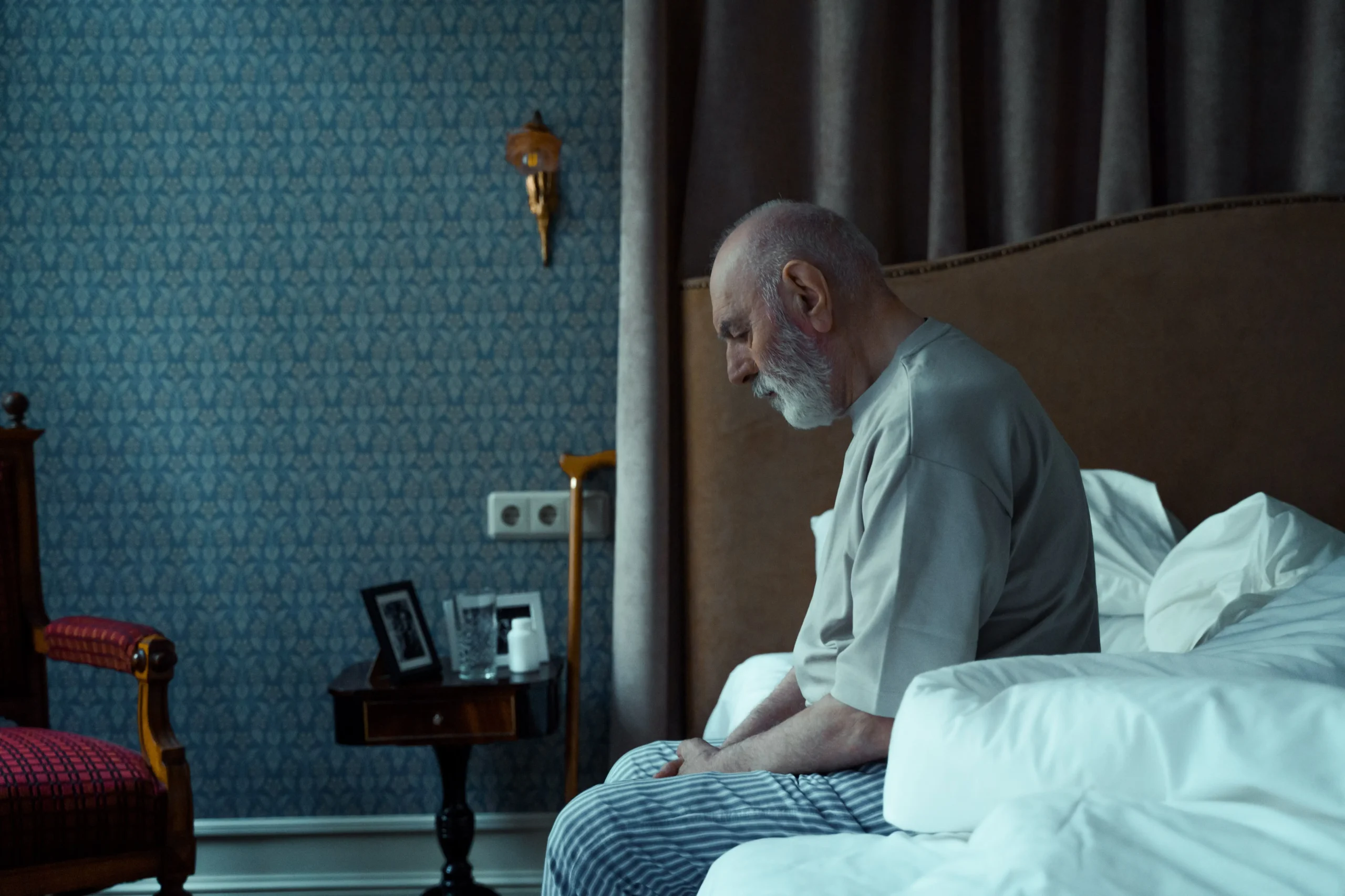 Man experiencing sleep disruption from frequent nighttime urination